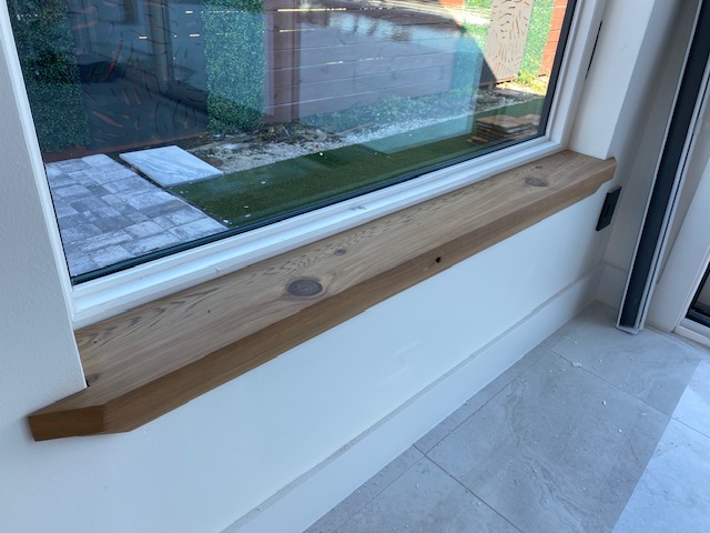 Timber window seat and glass wall