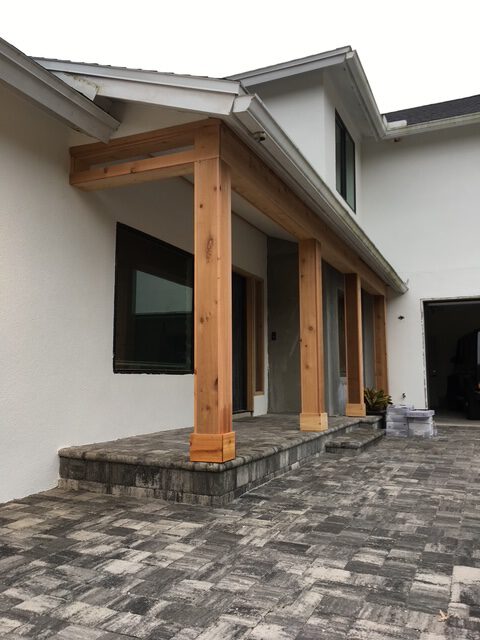 Cedar columns on a paver patio