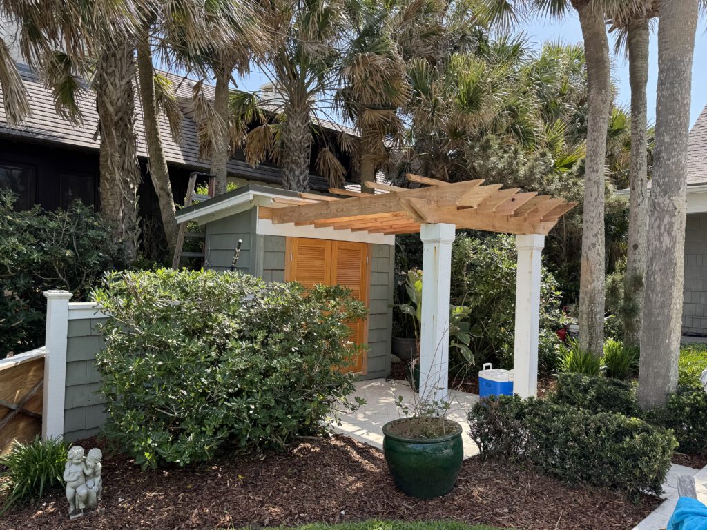 Pergola over a pool house